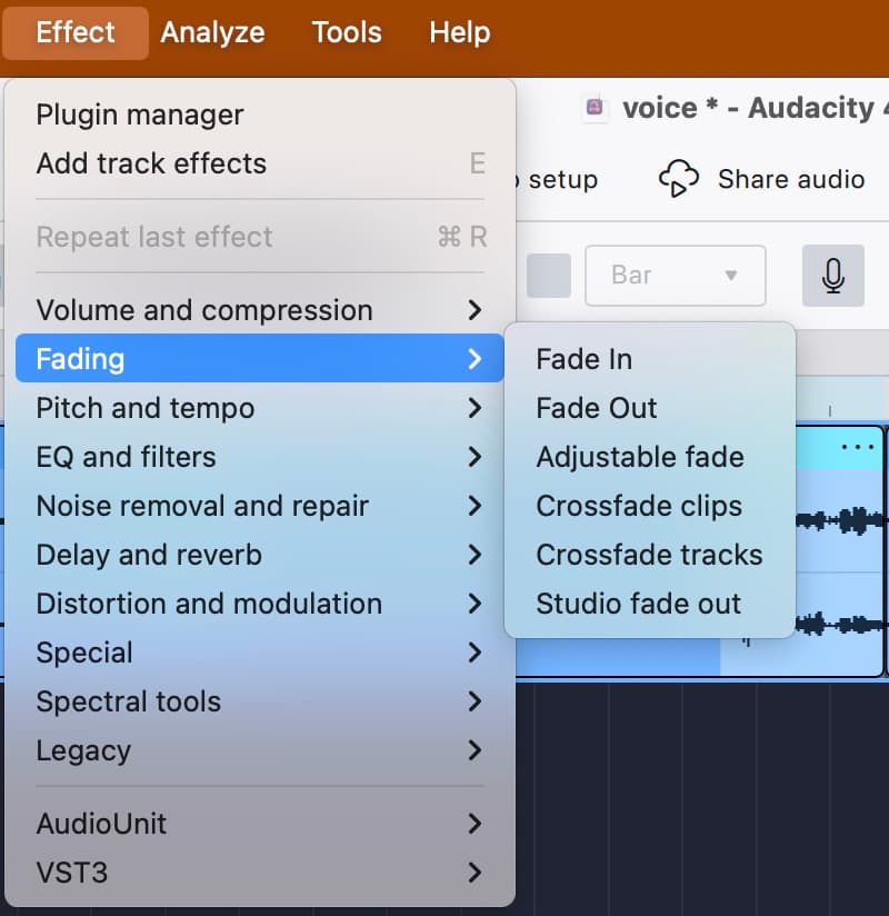 The Effect ▸ Fading submenu in Audacity 4 over the selected end of a clip, listing Fade In, Fade Out, Adjustable fade, Crossfade clips, Crossfade tracks and Studio fade out